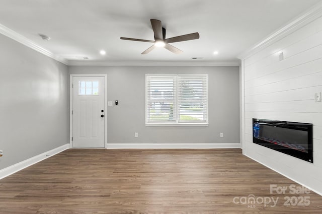 1067 Winchester Dr, Rock Hill, SC 29730 - entrance foyer featuring crown molding, ceiling fan, a large fireplace, wood finished floors, and baseboards