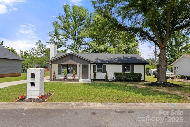 1067 Winchester Dr, Rock Hill, SC 29730 - view of front of property featuring a chimney, board and batten siding, and a front yard