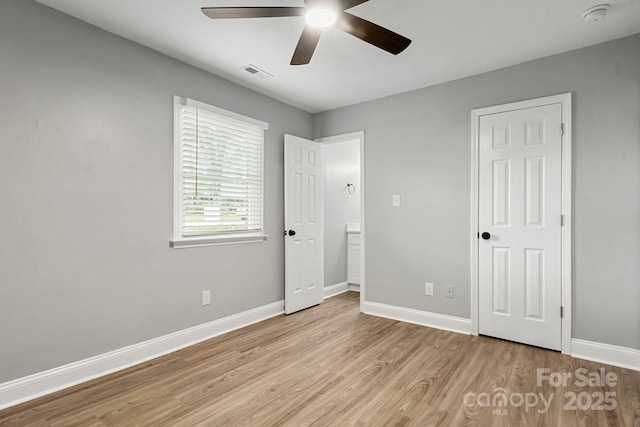 1067 Winchester Dr, Rock Hill, SC 29730 - unfurnished bedroom featuring light wood-style flooring, baseboards, and ceiling fan