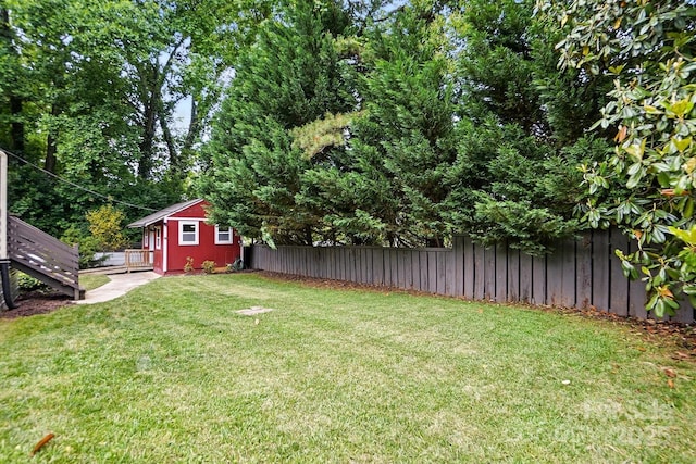 4235 Howie Cir, Charlotte, NC 28205 - view of yard featuring an outbuilding and a deck
