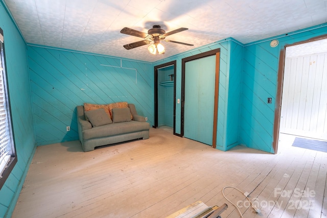 181 Settlers Ln, Waynesville, NC 28785 - unfurnished room featuring hardwood / wood-style flooring, a ceiling fan, and wood walls