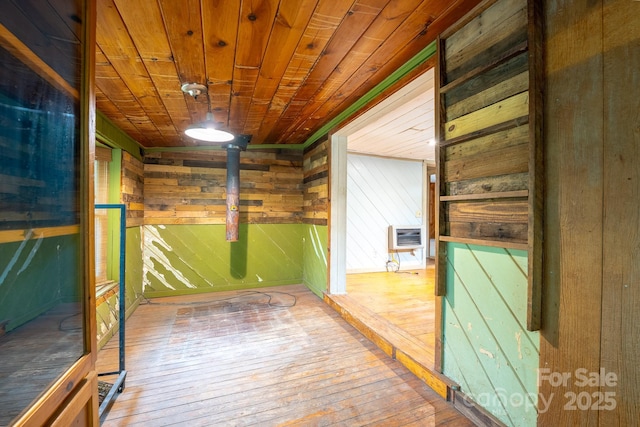 181 Settlers Ln, Waynesville, NC 28785 - hall featuring wood-type flooring, wooden walls, wooden ceiling, and heating unit