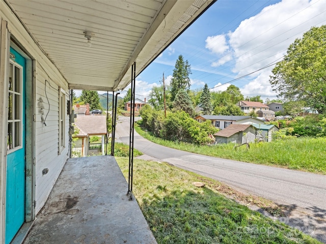 1224 Phillipsville Loop, Canton, NC 28716 - view of patio / terrace with covered porch and a residential view