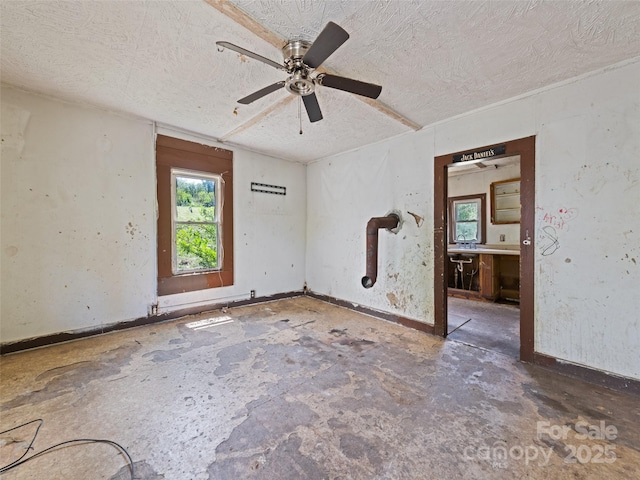 1224 Phillipsville Loop, Canton, NC 28716 - spare room featuring a textured ceiling, ceiling fan, and baseboards