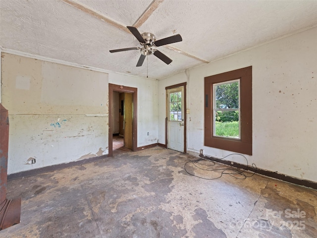 1224 Phillipsville Loop, Canton, NC 28716 - spare room featuring ceiling fan, a textured ceiling, and baseboards