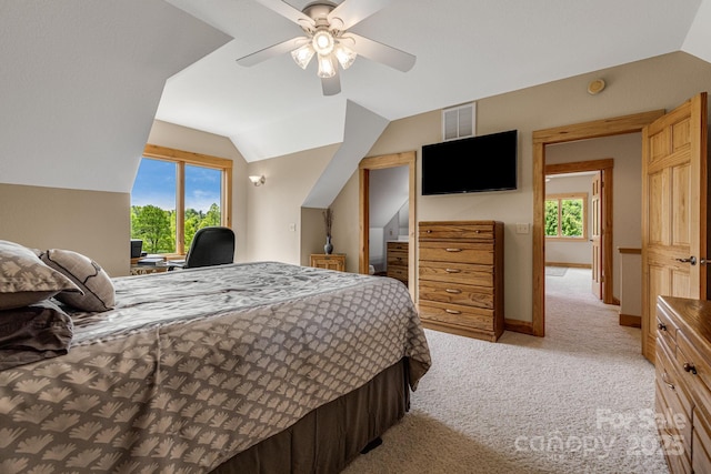 2912 Windswept Ridge Rd, Marshall, NC 28753 - bedroom with multiple windows, light carpet, lofted ceiling, a ceiling fan, and baseboards