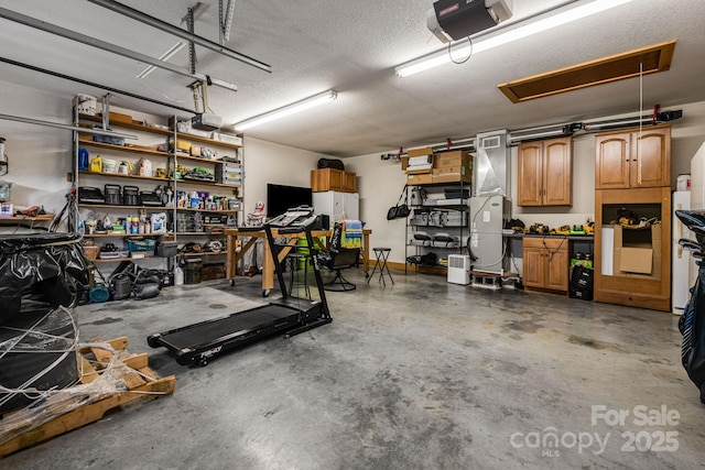 2912 Windswept Ridge Rd, Marshall, NC 28753 - garage featuring a garage door opener