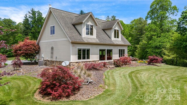 2912 Windswept Ridge Rd, Marshall, NC 28753 - view of property exterior featuring a shingled roof, a yard, and central AC