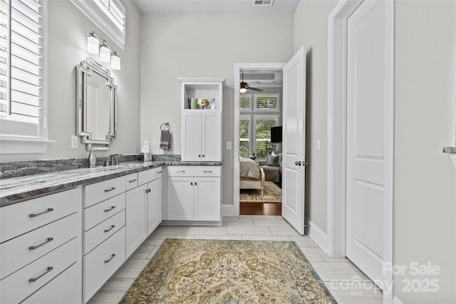 9750 Briarwick Ln, Charlotte, NC 28277 - ensuite bathroom featuring a ceiling fan and vanity