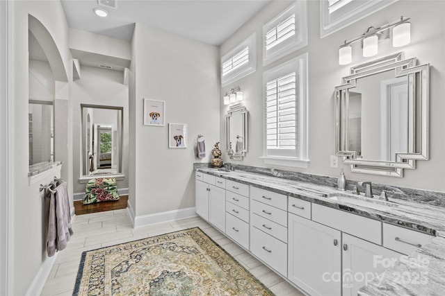 9750 Briarwick Ln, Charlotte, NC 28277 - full bath featuring double vanity and baseboards