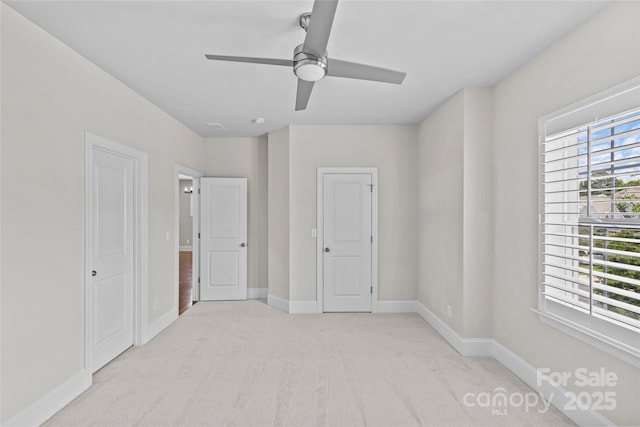 9750 Briarwick Ln, Charlotte, NC 28277 - unfurnished bedroom with light carpet, baseboards, and a ceiling fan