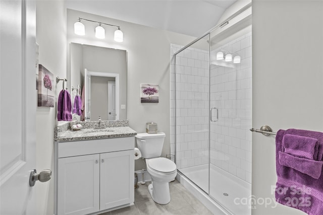 9750 Briarwick Ln, Charlotte, NC 28277 - bathroom featuring vanity, toilet, a stall shower, and tile patterned floors