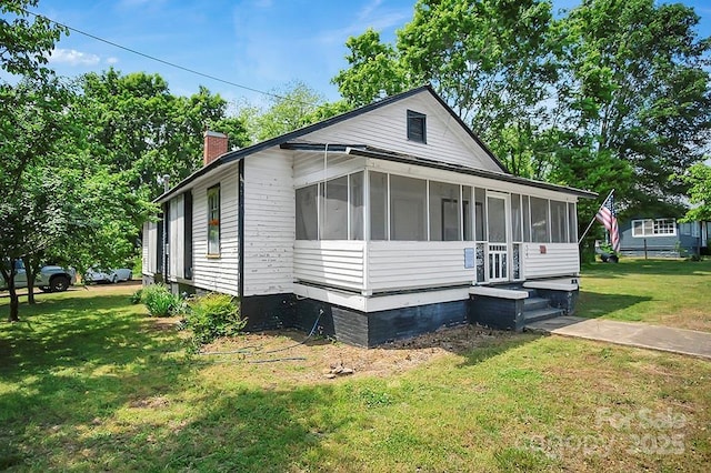 514 S Martin St, Shelby, NC 28150 - view of side of property featuring a sunroom, a chimney, and a lawn