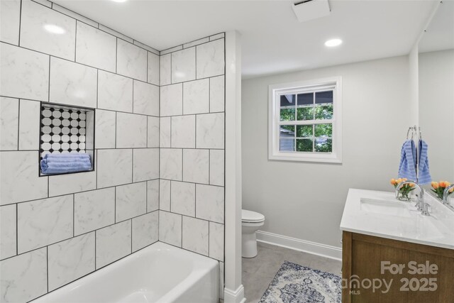 bathroom featuring toilet, vanity, baseboards, and washtub / shower combination