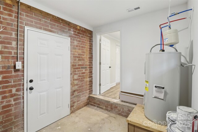 view of exterior entry with water heater