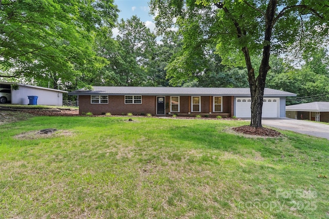 ranch-style house featuring driveway, an attached garage, a front yard, and brick siding