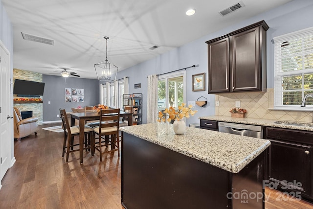 6119 Castlecove Rd, Charlotte, NC 28278 - kitchen featuring a sink, stainless steel dishwasher, a center island, dark wood-type flooring, and ceiling fan