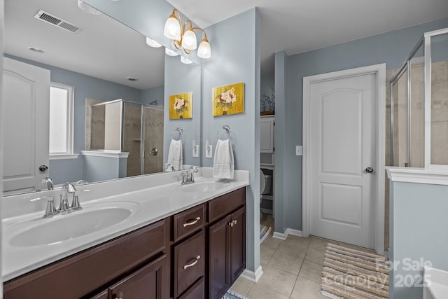 6119 Castlecove Rd, Charlotte, NC 28278 - full bathroom with a stall shower, tile patterned flooring, and double vanity
