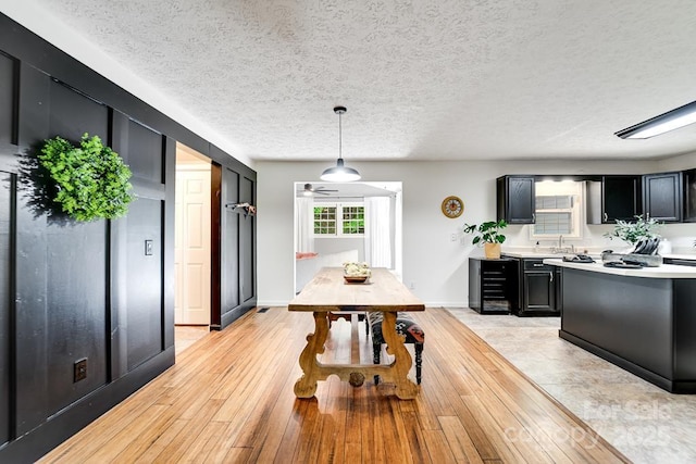 41 Kings Creek Dr, Sylva, NC 28779 - dining space featuring light wood-style flooring, a textured ceiling, baseboards, and a ceiling fan