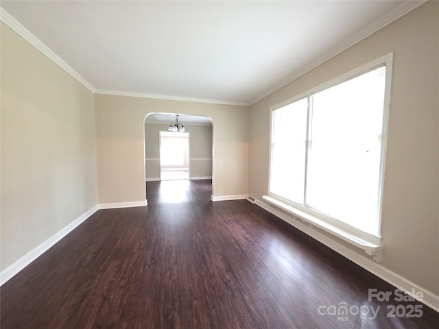 3316 Mckee Rd, Charlotte, NC 28270 - spare room with arched walkways, dark wood-style flooring, baseboards, and ornamental molding