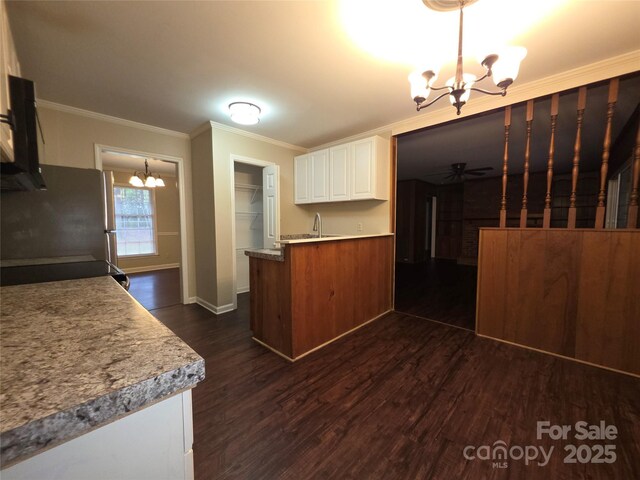 3316 Mckee Rd, Charlotte, NC 28270 - kitchen featuring a chandelier, freestanding refrigerator, white cabinets, dark wood finished floors, and ceiling fan
