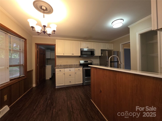 3316 Mckee Rd, Charlotte, NC 28270 - kitchen with appliances with stainless steel finishes, ornamental molding, white cabinetry, dark wood-type flooring, and a chandelier