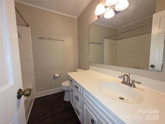 3316 Mckee Rd, Charlotte, NC 28270 - bathroom featuring ornamental molding, toilet, vanity, baseboards, and wood finished floors
