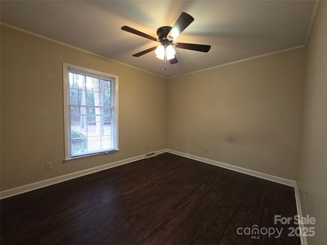 3316 Mckee Rd, Charlotte, NC 28270 - unfurnished room featuring dark wood-style flooring, baseboards, a ceiling fan, and crown molding