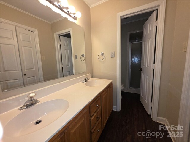 3316 Mckee Rd, Charlotte, NC 28270 - full bathroom featuring toilet, double vanity, crown molding, wood finished floors, and a shower stall