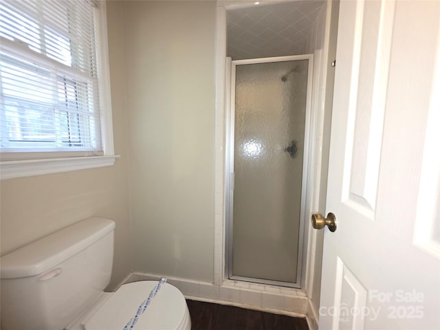 3316 Mckee Rd, Charlotte, NC 28270 - bathroom with toilet, plenty of natural light, a stall shower, and baseboards