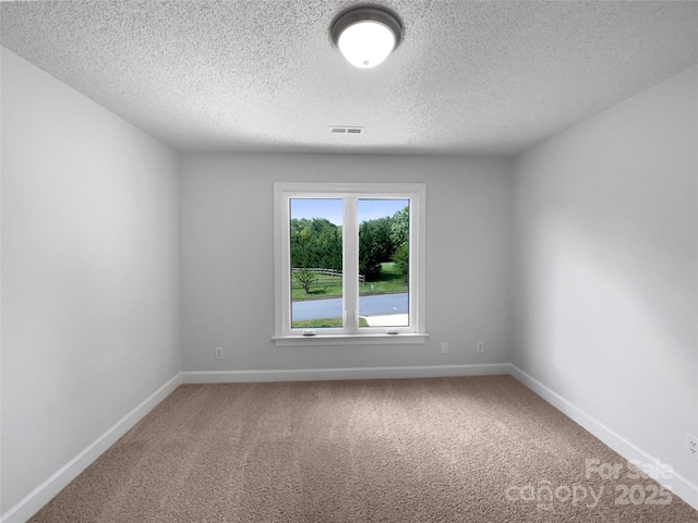 2532 Steeplechase Rd, Gastonia, NC 28056 - spare room with carpet flooring, a textured ceiling, and baseboards