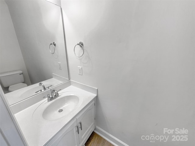 2532 Steeplechase Rd, Gastonia, NC 28056 - bathroom featuring vanity, toilet, and wood finished floors
