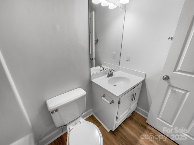 2532 Steeplechase Rd, Gastonia, NC 28056 - half bath featuring wood finished floors, toilet, vanity, and baseboards