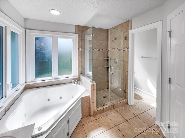2532 Steeplechase Rd, Gastonia, NC 28056 - bathroom featuring a textured ceiling, a shower stall, tile patterned flooring, and a jetted tub