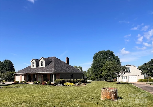 1351 Hardin Rd, Dallas, NC 28034 - view of home's exterior featuring a garage, a lawn, brick siding, concrete driveway, and a chimney