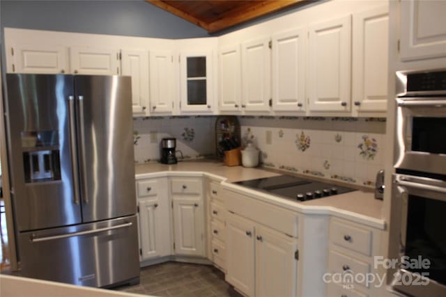 1351 Hardin Rd, Dallas, NC 28034 - kitchen with appliances with stainless steel finishes, white cabinets, light countertops, backsplash, and lofted ceiling