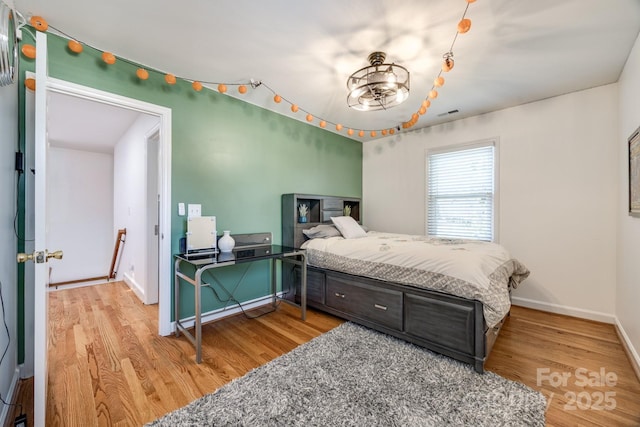 2702 Oxborough Dr, Matthews, NC 28105 - bedroom featuring light wood-type flooring and baseboards
