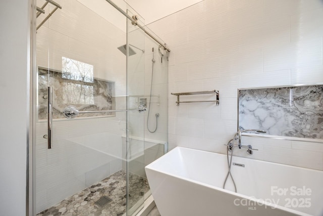 2702 Oxborough Dr, Matthews, NC 28105 - bathroom featuring a shower stall and a freestanding tub