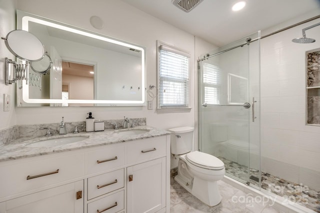 2702 Oxborough Dr, Matthews, NC 28105 - bathroom with a stall shower, toilet, and double vanity