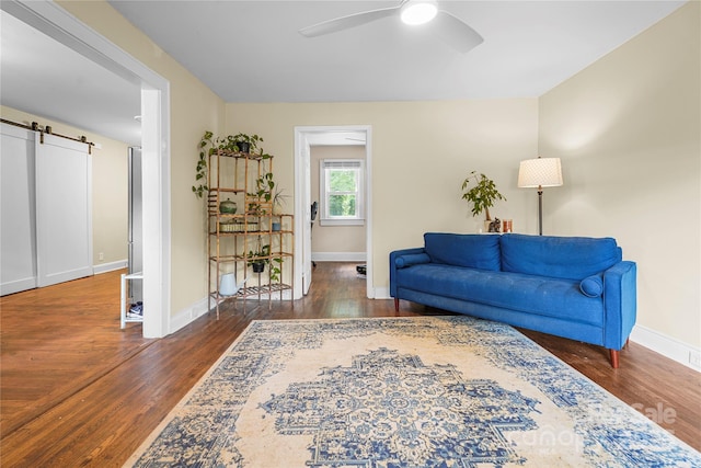 108 Greenwood Ave, Belmont, NC 28012 - living area featuring ceiling fan, wood finished floors, a barn door, and baseboards
