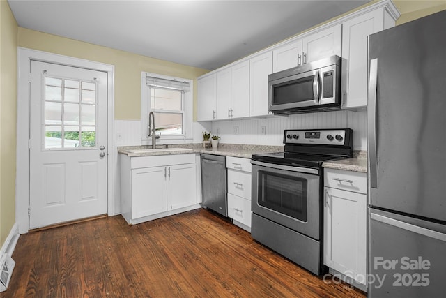 108 Greenwood Ave, Belmont, NC 28012 - kitchen featuring stainless steel appliances, a sink, white cabinetry, and dark wood finished floors