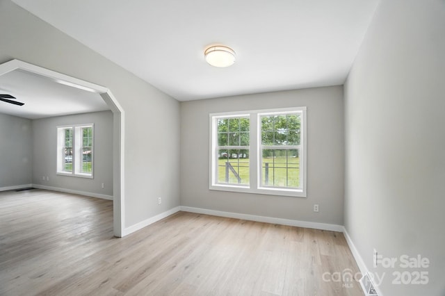 12382 Ritchie Rd, Midland, NC 28107 - empty room with healthy amount of natural light, light wood-style floors, and baseboards