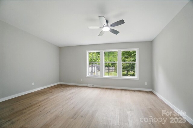 12382 Ritchie Rd, Midland, NC 28107 - spare room with ceiling fan, wood finished floors, and baseboards