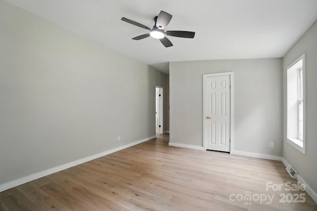 12382 Ritchie Rd, Midland, NC 28107 - empty room featuring light wood finished floors, ceiling fan, and baseboards