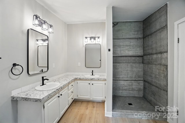 12382 Ritchie Rd, Midland, NC 28107 - full bath with wood finished floors, double vanity, and tiled shower