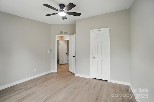 12382 Ritchie Rd, Midland, NC 28107 - unfurnished bedroom featuring light wood-style floors, baseboards, and ceiling fan