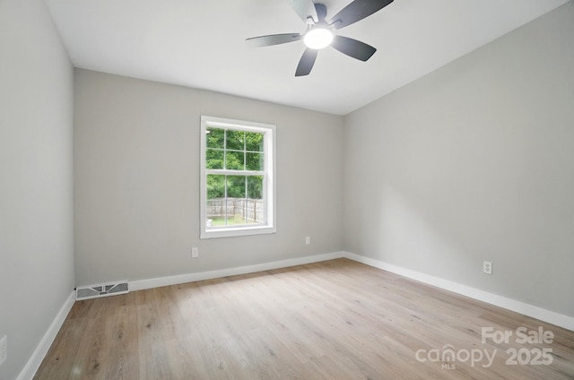 12382 Ritchie Rd, Midland, NC 28107 - unfurnished room with wood finished floors, baseboards, and ceiling fan