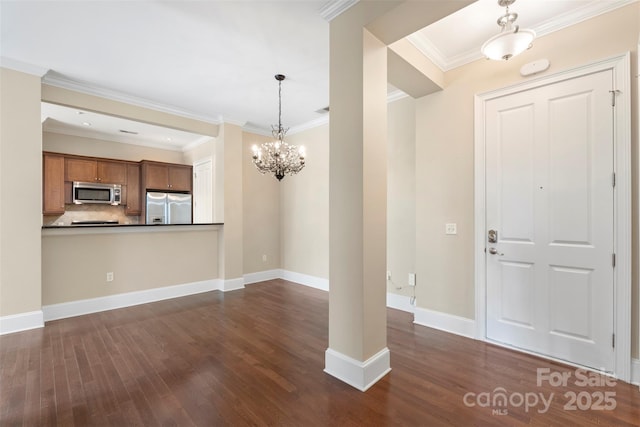 5425 Closeburn Rd Unit 208, Charlotte, NC 28210 - foyer entrance with dark wood-style flooring, a chandelier, ornamental molding, and baseboards