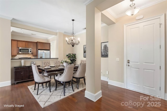 5425 Closeburn Rd Unit 208, Charlotte, NC 28210 - dining area featuring dark wood-style flooring, a chandelier, crown molding, and baseboards