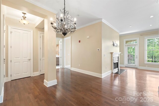 5425 Closeburn Rd Unit 208, Charlotte, NC 28210 - unfurnished living room with wood finished floors, ornamental molding, baseboards, a chandelier, and a fireplace